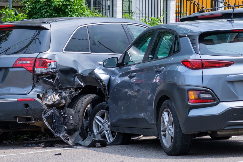 A car collision with a parked vehicle on a New Orleans neighborhood street, a scenario often requiring a personal injury lawyer in New Orleans.