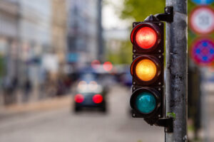Traffic lights over urban intersection. Red light. Car Accident Attorney in New Orleans